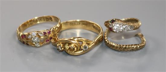 An Edwardian 18ct gold and gem set ring, one other 18ct and gem set ring (stone missing) and a 9ct and gem set serpent ring.